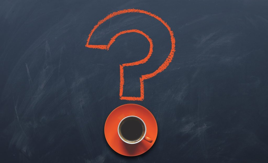 Hand holding a question mark – representing research and product selection process
