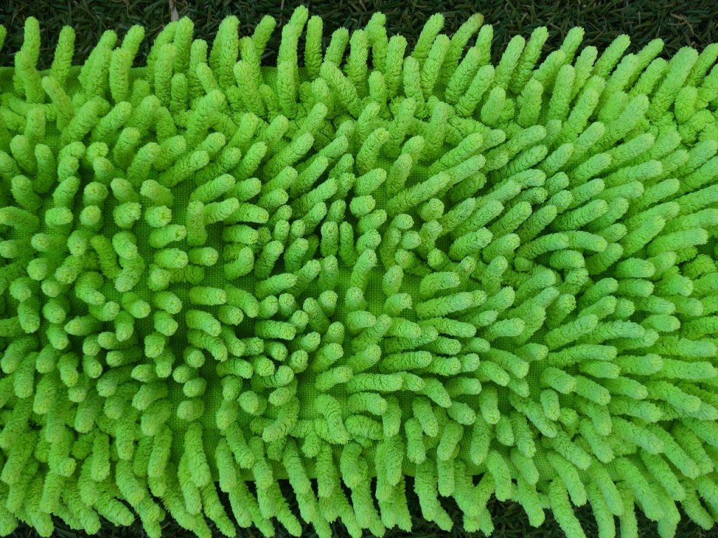 A microfiber mop on a laminate floor, showing the best mop for laminate floor in action.