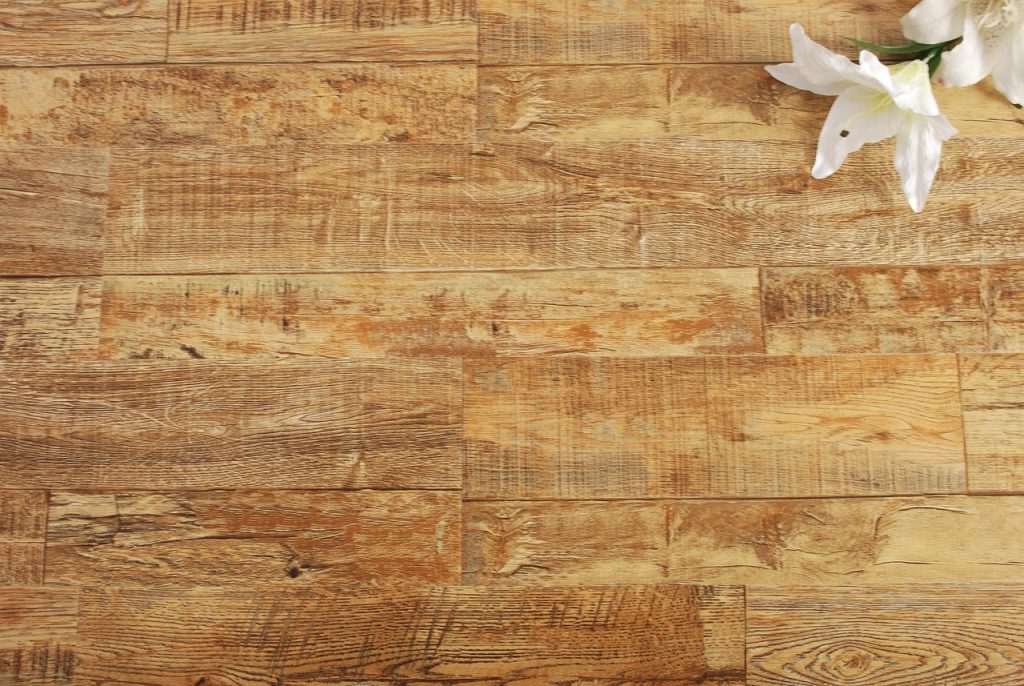 Scratched wood flooring showing damage before applying fix to get rid of floor scratches