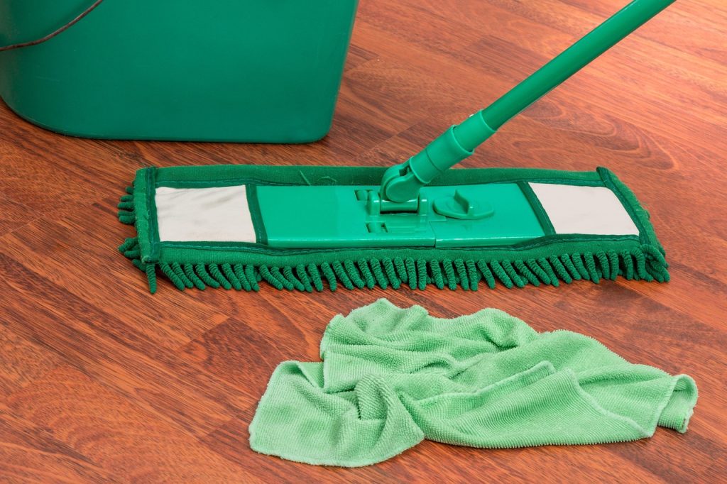 Microfiber mop, bucket, and wiper on laminate flooring