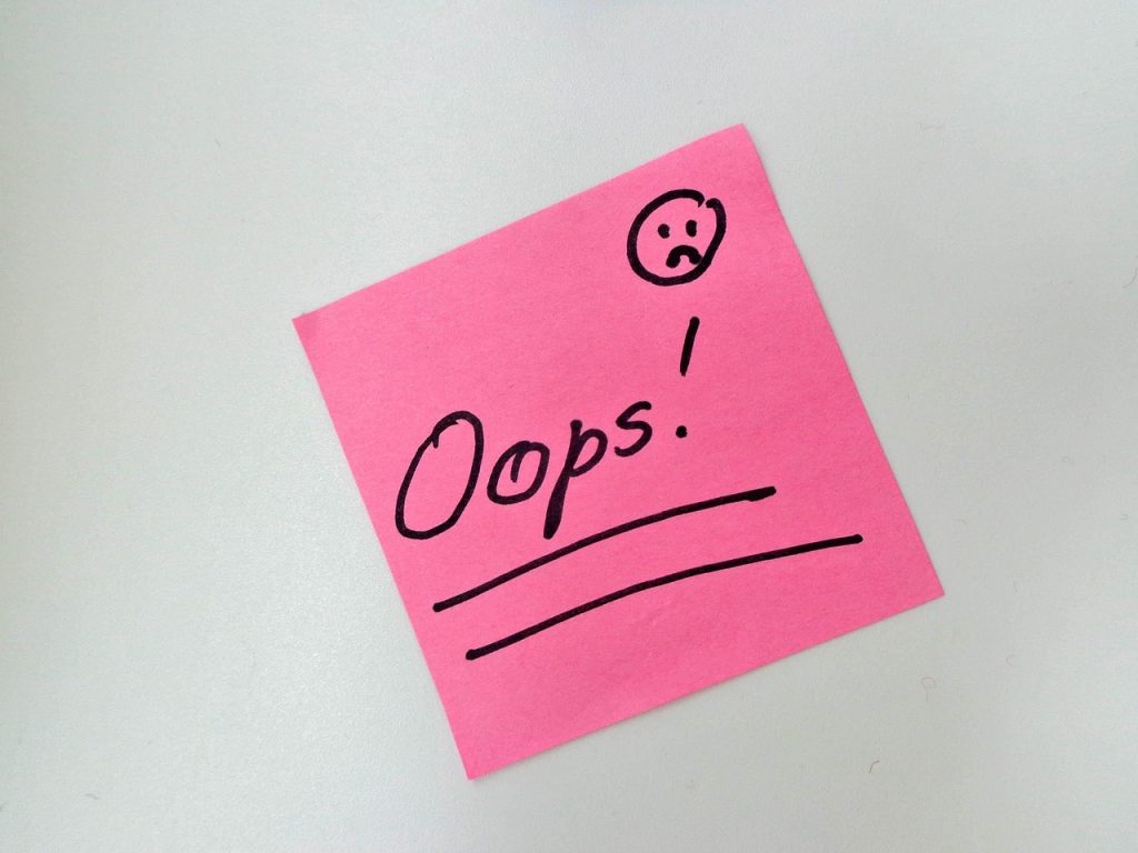 Word βOops!β with a mistake emoji expressing regret or surprise