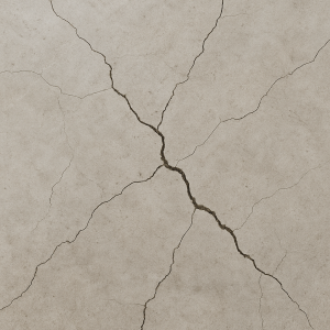 Close-up of cracks in a concrete floor surface