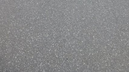 Shiny white concrete floor restored to a clean, bright finish