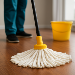 Close-up of a mop gliding across shiny tile floors with water reflections, showing deep cleaning results.