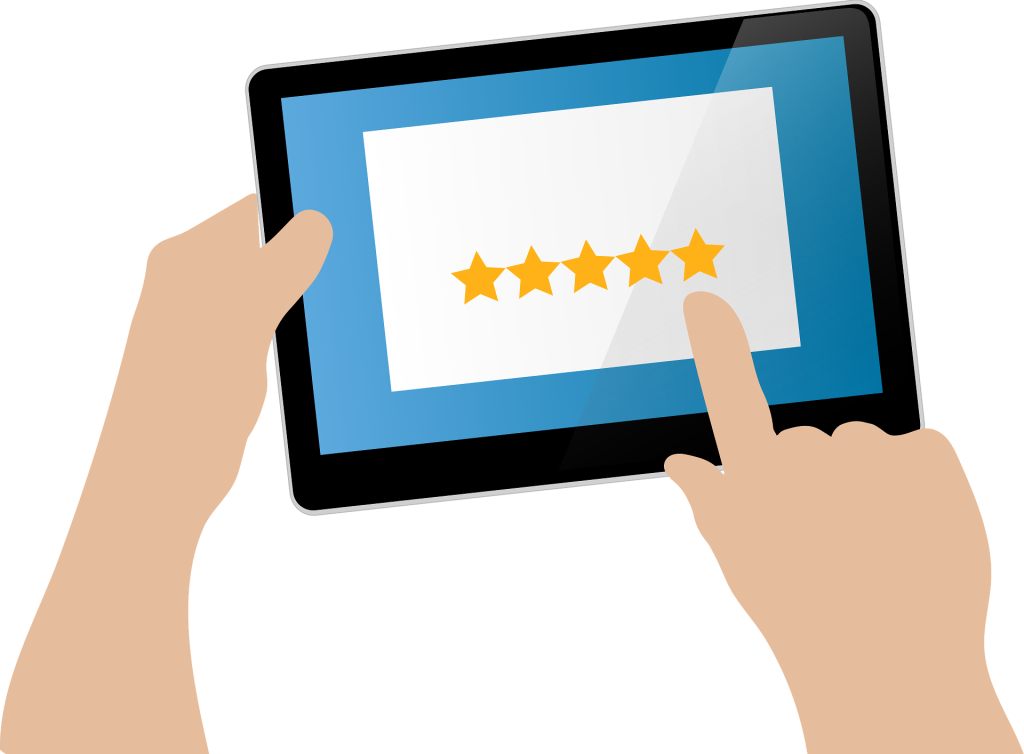 Hands holding a tablet with a five-star rating showing positive user feedback for the best floor mop for tile floors.
