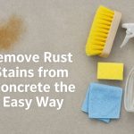 Cleaning rust stain on concrete using simple tools for a sparkling surface.