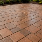 Freshly sealed paver patio with a smooth, glossy finish.