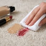 Hand blotting foundation and lipstick stains from a light carpet