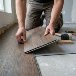 Someone installing spc flooring planks